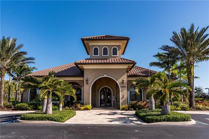 View of building exterior with decorative driveway