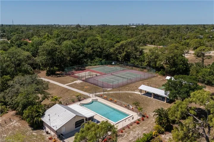 Drone / aerial view with a wooded view