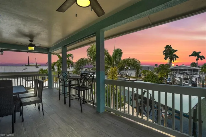 Deck at dusk featuring ceiling fan