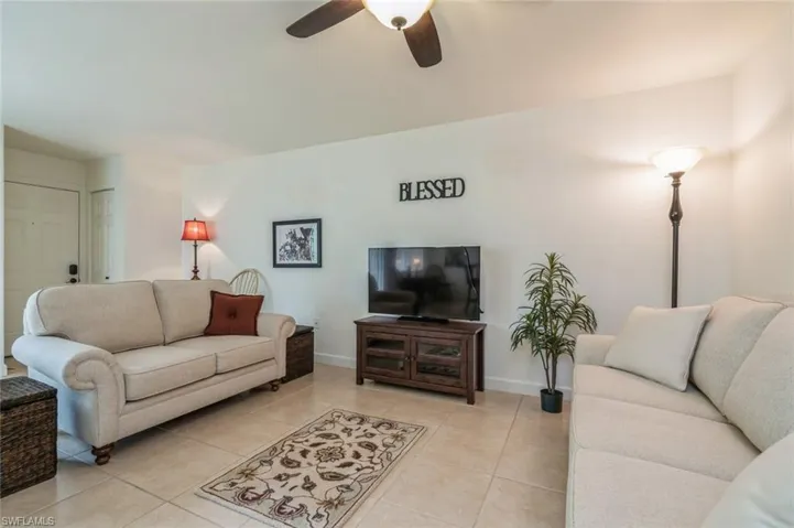 Tiled living room with ceiling fan