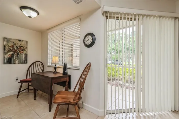Home office with light tile floors