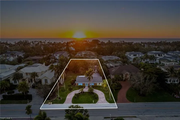 Ariel Sunset view with lot grid lines. Walk to SUNSET over the Gulf of America, just two blocks away!