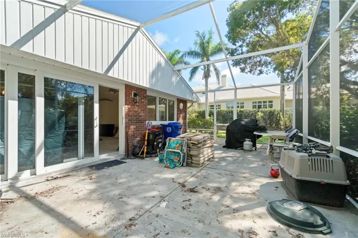 View of patio with a lanai and grilling area