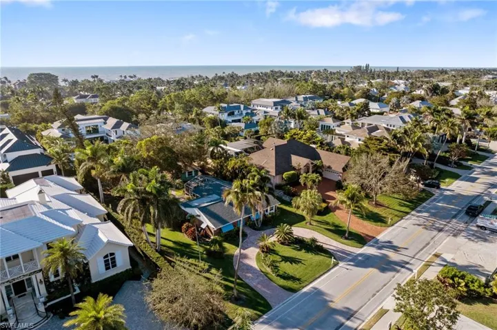 Drone / aerial view featuring a water view and a residential view