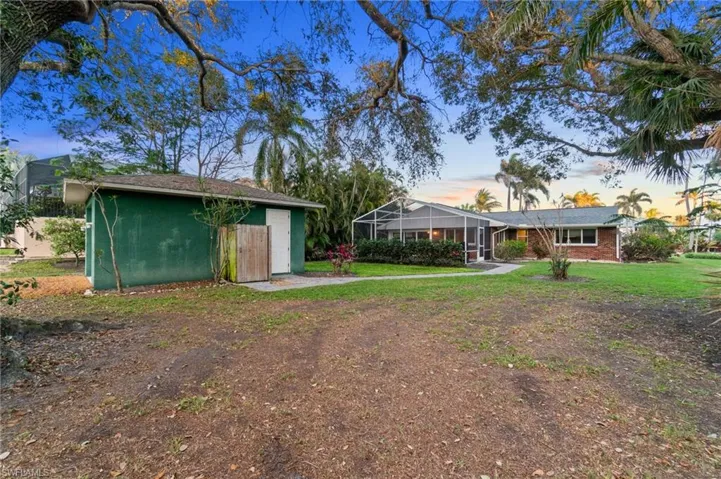 Rear garage structure is situated on resident rear access road on the west side.