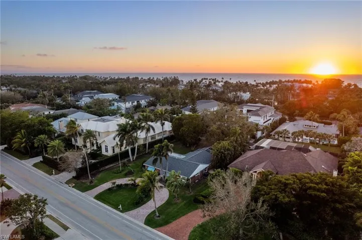 Aerial view at SUNSET.  Lot has sought after western rear exposure!