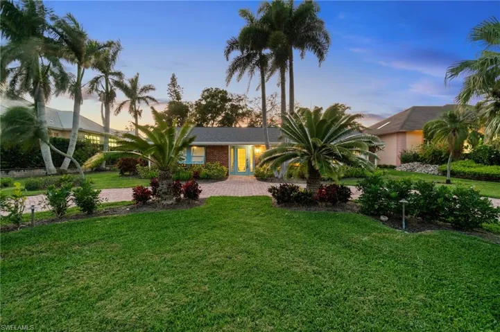View of front of property featuring convenient circular driveway for entertaining.
