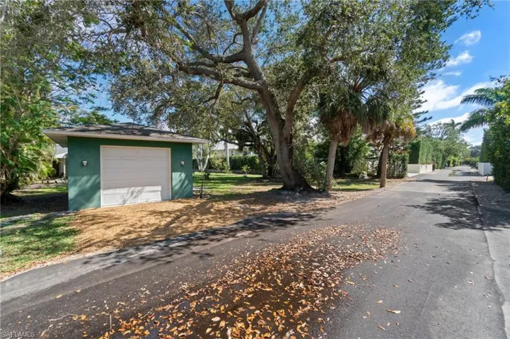 View of rear access street on west side of the property.