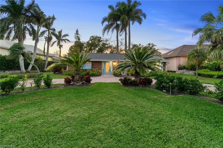 OPPORTUNITY : rebuild or build your own dream residence!  Ideal western exposure. Florida rancher elevation with mature, tropical landscaping surrounding the lot and beautiful paver, circular driveway. Perfect for entertaining with extra guest parking.