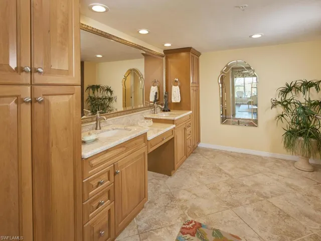 Dual sinks with vanity and walk in shower