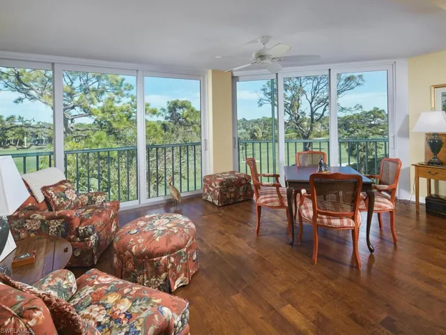 Glassed in lanai with impact glass sliders and lovely wood floors