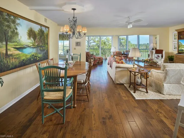 Dining area featuring engineered hardwood floors and notable chandelier