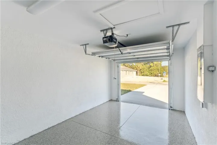 Garage featuring a garage door opener