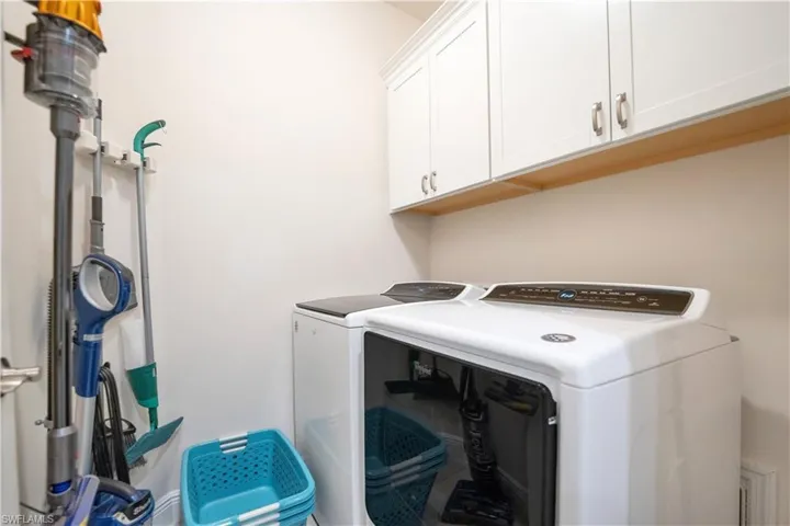 Laundry room featuring cabinet space and washing machine and dryer