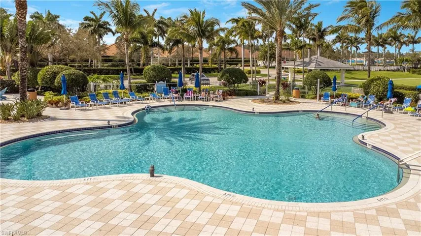 Community pool featuring a patio area