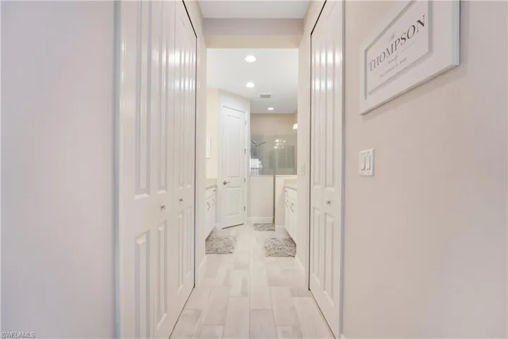 Hall featuring light wood-type flooring, recessed lighting, visible vents, and baseboards