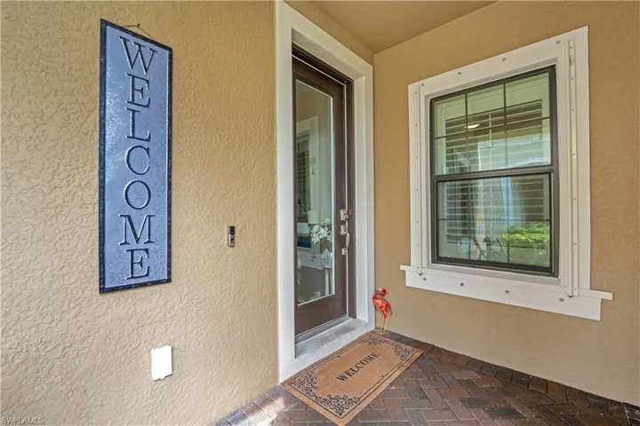 Entrance to property with stucco siding