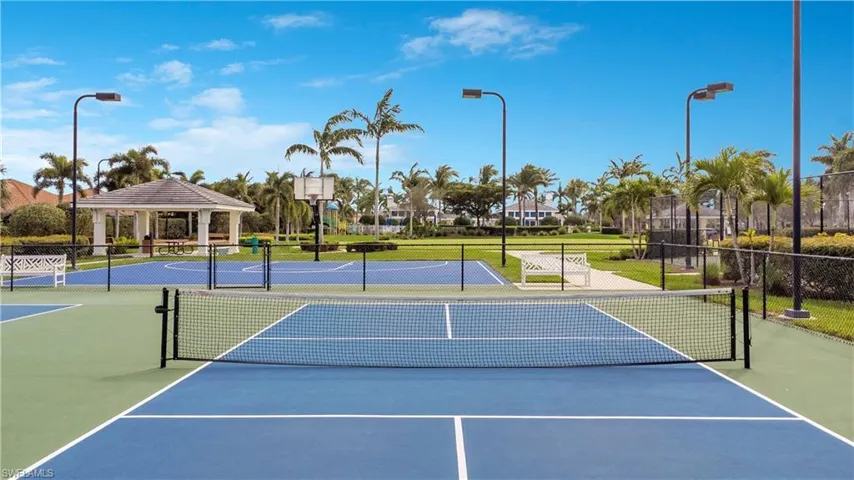 View of sport court featuring a gazebo and fence