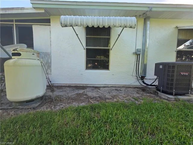 View of home's exterior featuring a central air condition unit and stucco siding