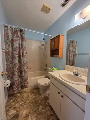 Master bedroom featuring wood finished floors and ceiling fan