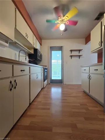 Entryway featuring light wood finished floors and baseboards