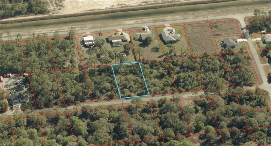Aerial map of property and surrounding area featuring property parcel outlined