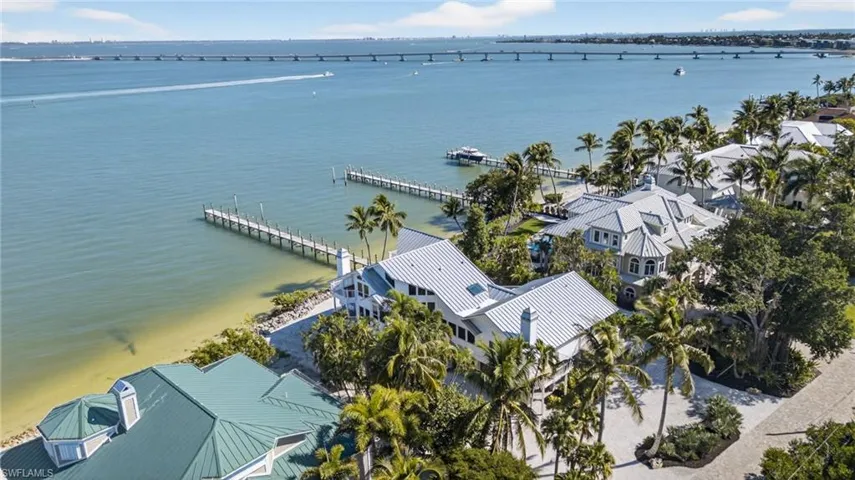 Drone / aerial view of a notable bridge and a large body of water
