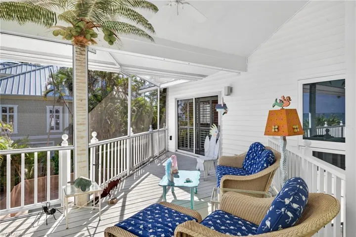 Sunroom featuring plenty of natural light and a ceiling fan