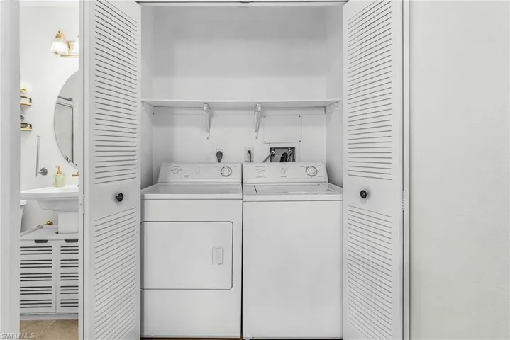 Laundry area featuring separate washer and dryer
