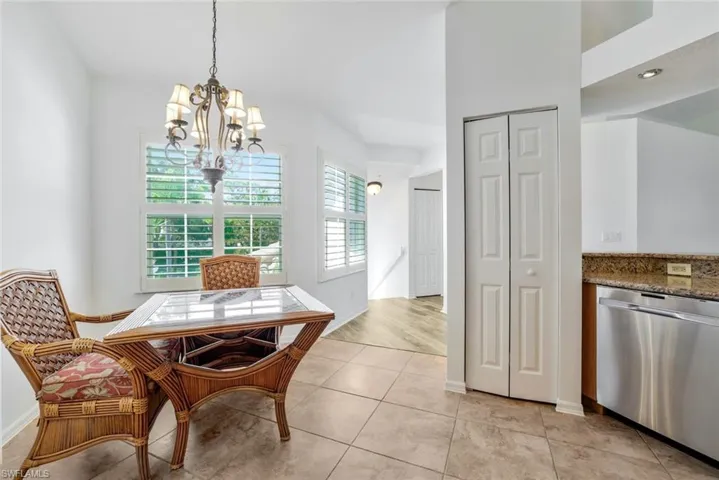 Your morning room off the kitchen, chandelier, granite countertops, and stainless steel dishwasher