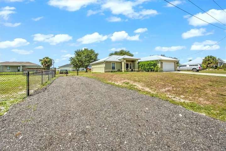 Corner lot with new driveway and culvert with easy access to double gate.