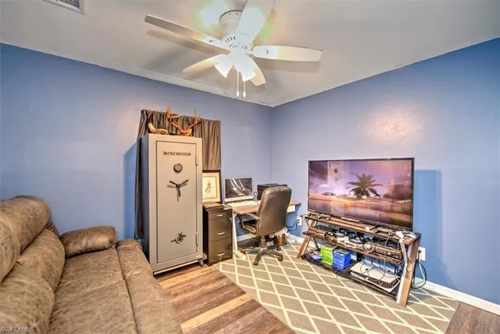Bedroom 3, new fan, vinyl plank flooring and new doors.