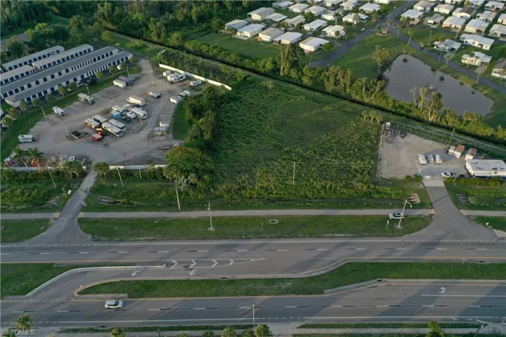 Aerial view of property's location featuring a nearby body of water
