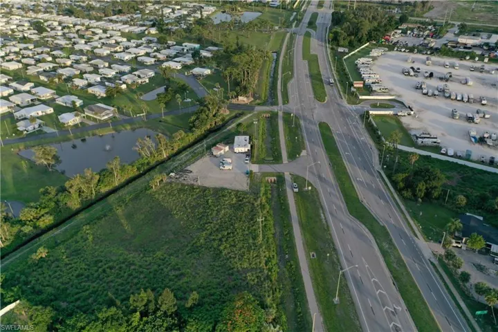 Aerial view of property's location featuring a nearby body of water