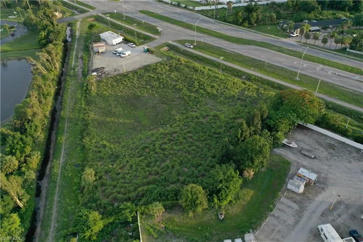 Aerial overview of property's location with a large body of water