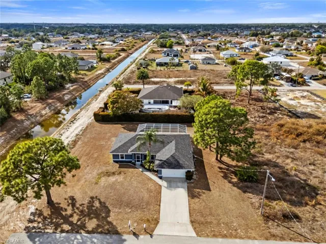 Aerial perspective of suburban area with a large body of water