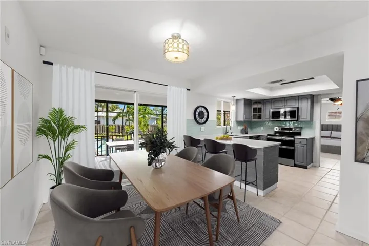 *Virtual Stage - Eat-in kitchen and bar seating! Bright, light-filled space with pool view while entertaining!