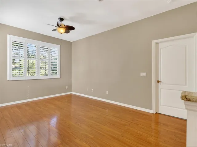 Unfurnished room with a ceiling fan and light wood finished floors