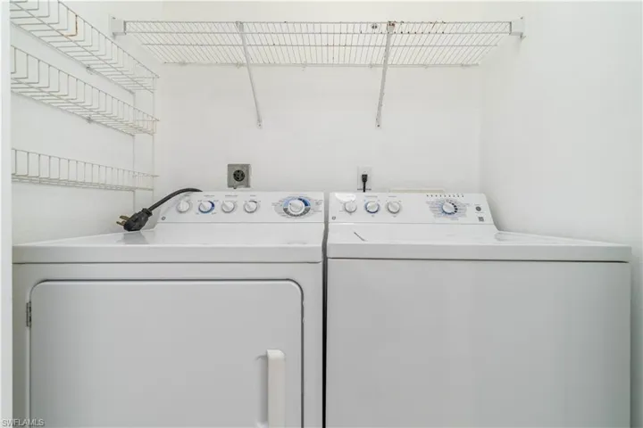 Laundry area featuring independent washer and dryer and laundry area