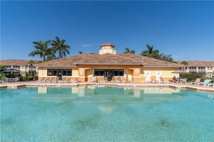 Pool featuring fence and a patio