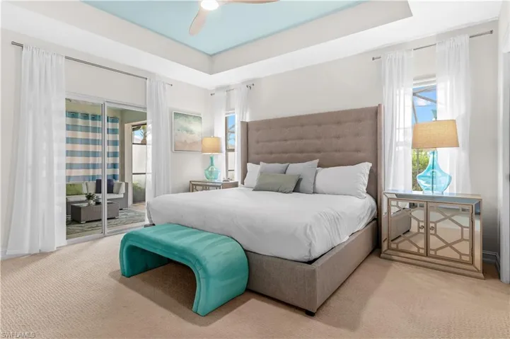 Tray ceiling with a light blue inset and a ceiling fan