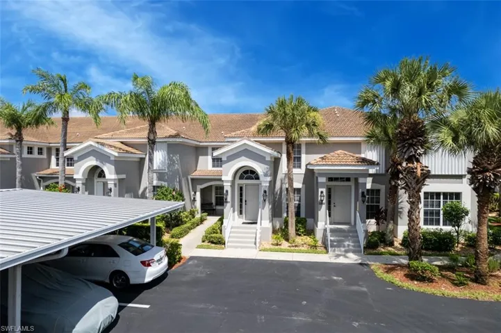 View of front facade with a carport