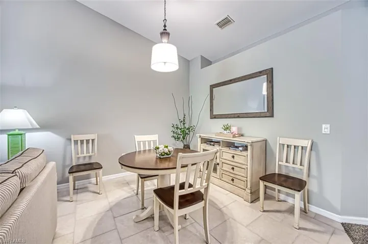 Dining area with light tile floors