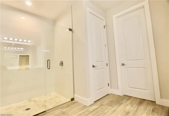Bathroom with a shower with shower door