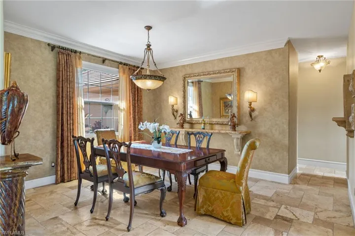Dining room featuring crown molding