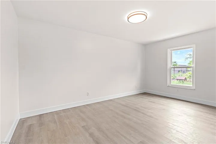Unfurnished room with light hardwood / wood-style flooring