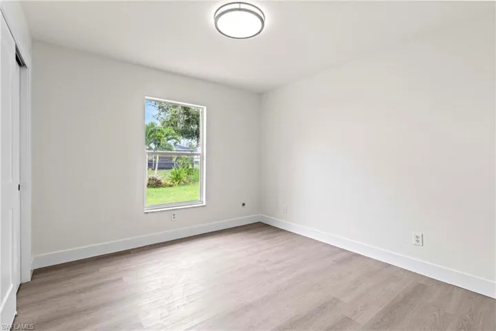 Unfurnished room with light hardwood / wood-style floors