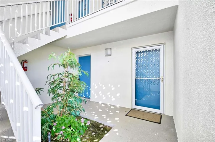 Doorway to property with a balcony