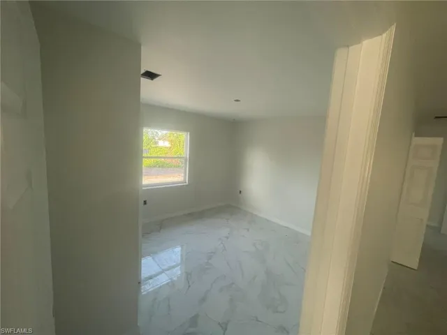 Spare room featuring light tile patterned flooring
