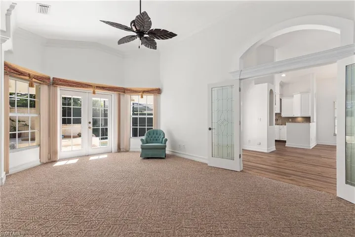 The spacious owner's suite offers a seating area overlooking the pool and spa.